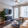 Furnished apartment living room with large windows at Element Galleria Apartments
